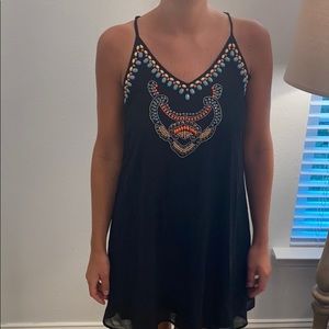 Black swing dress with beaded detail